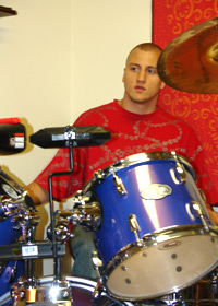 A young man at a drum set
